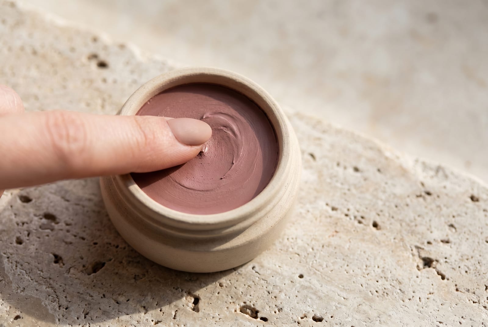 A soft summer beauty macro: a single palette-hex color detail at extreme close-up, the pigment caught in soft directional daylight against a matte background.