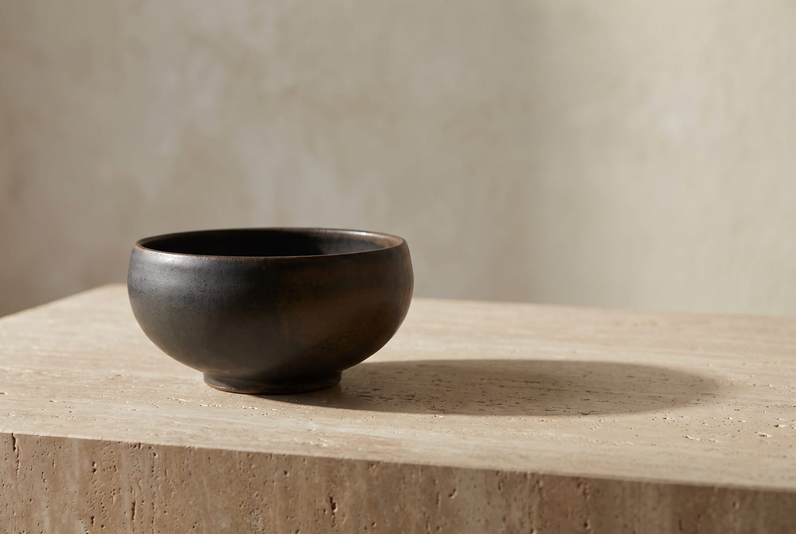 A deep autumn single-object study: one palette-hex subject (a folded espresso knit or a small burnished-bronze vessel) on dark slate with generous negative space, intentionally quiet after the 24-swatch color block.