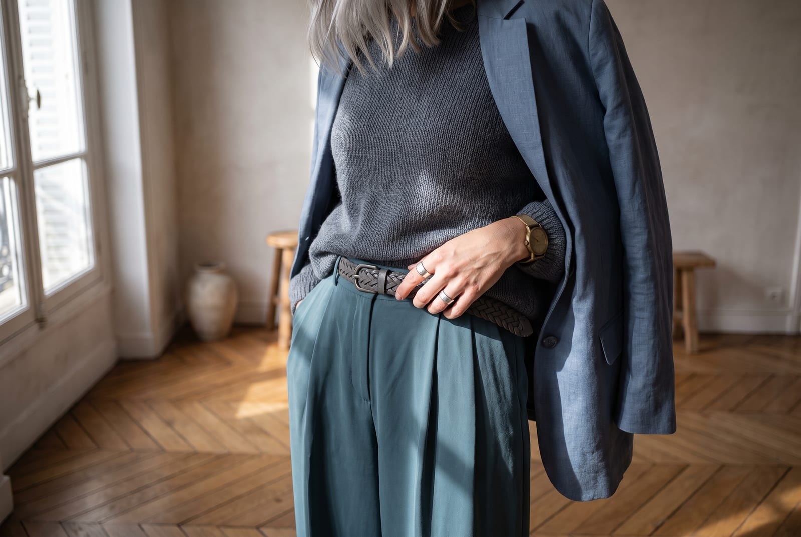 A cool summer worn detail: a cropped-figure composition showing a palette-hex slate-blue, cool-rose, or soft-summer-white piece worn close to the body in soft flat daylight, face out of frame in the style of catalog editorial.